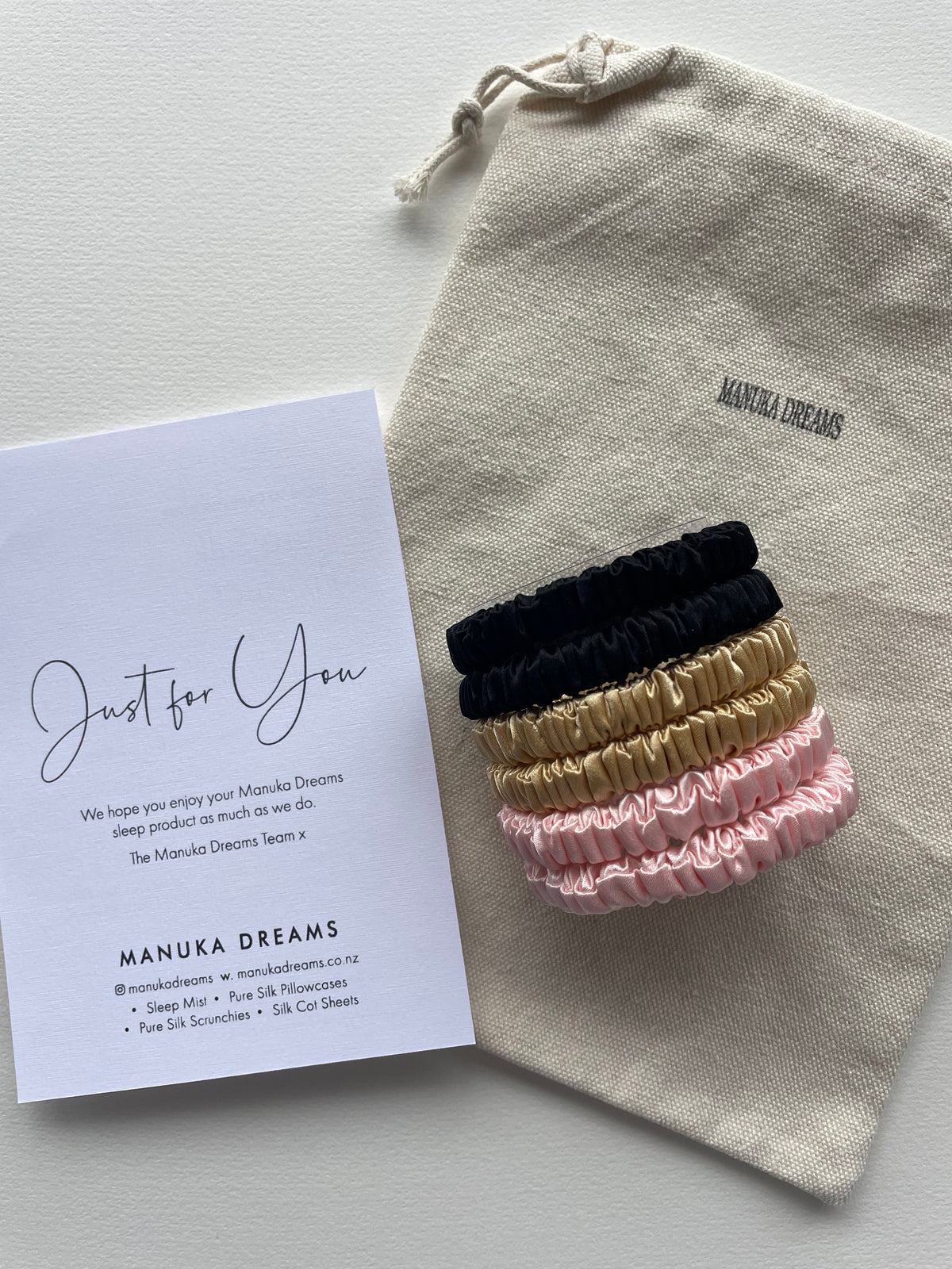 Silk scrunchies in black gold pink on pouch with Just for You card