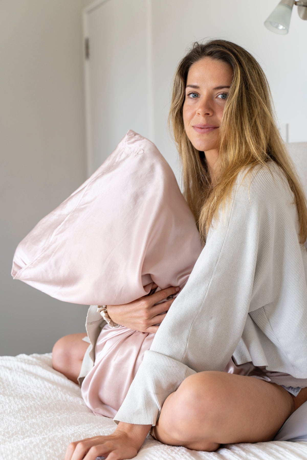 Women Holding Silk Pillowcase – Lavender